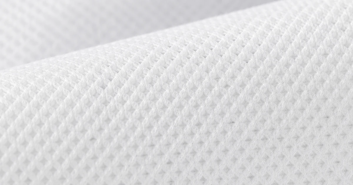 Macro view of spunbond non woven fabric showing the bonded fibre pattern